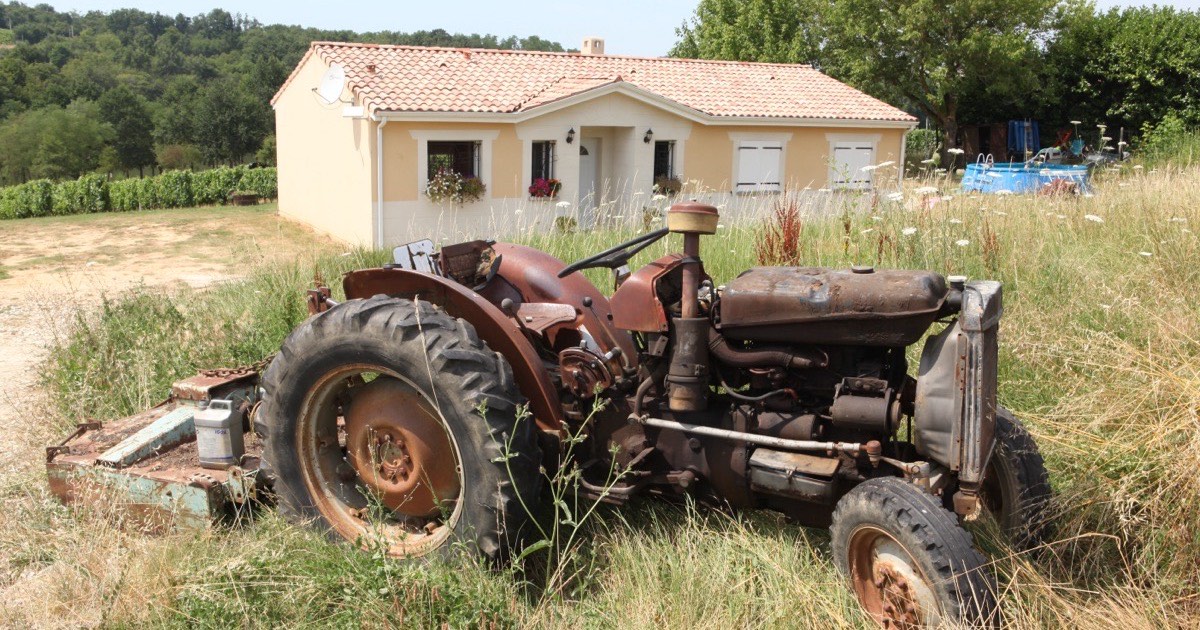 A rusty vintage tractor before restoration
