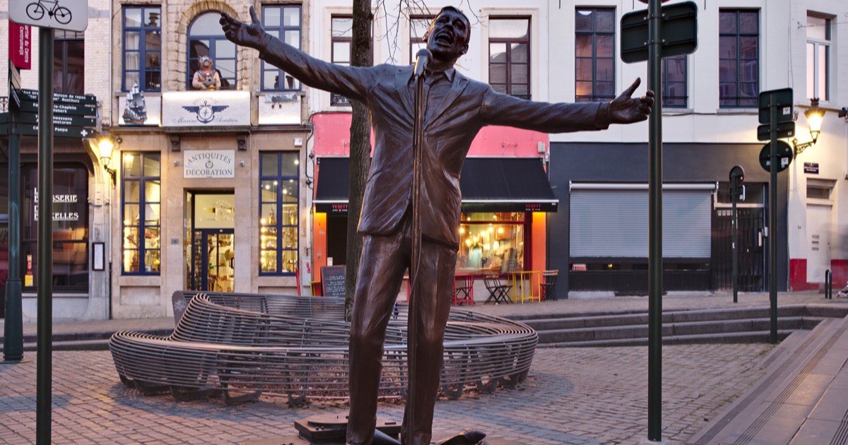 A bronze statue being carefully cleaned