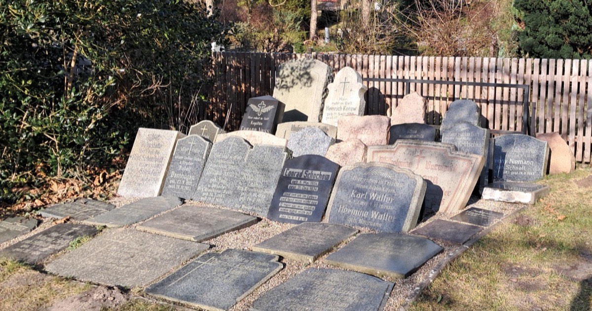 An old weathered headstone in a churchyard
