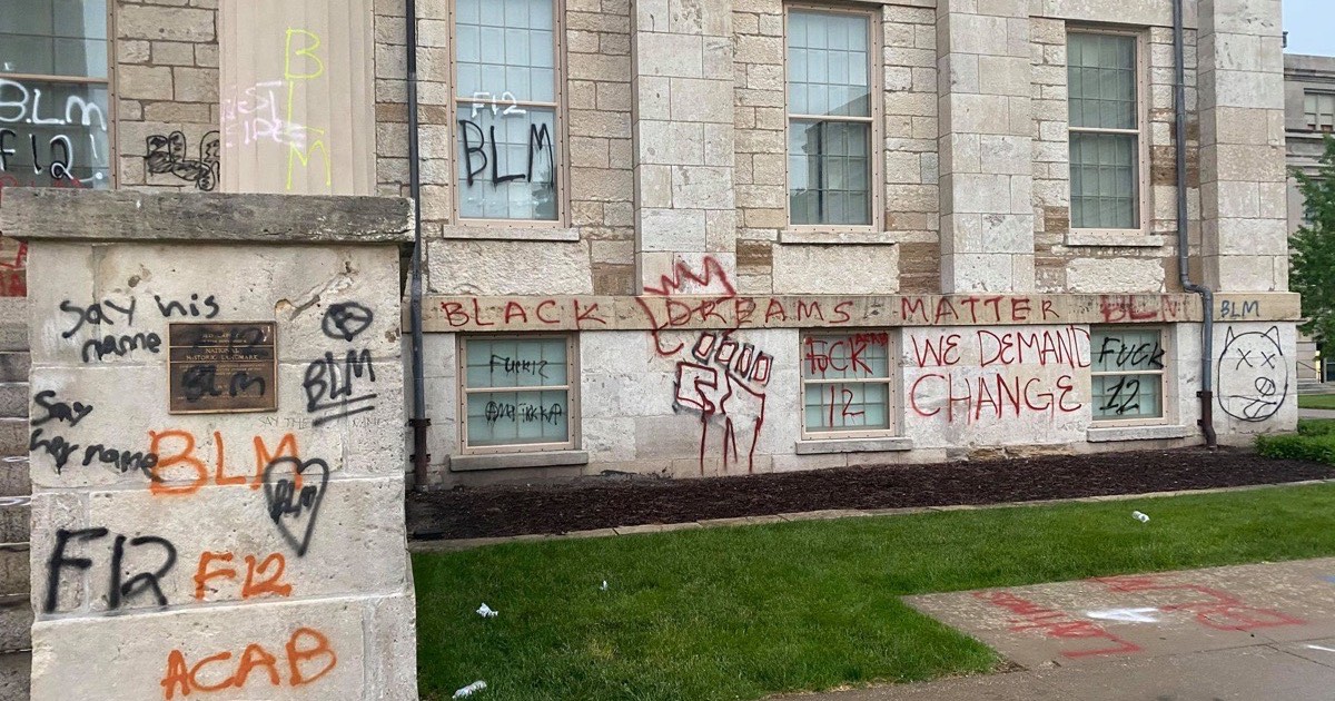 Graffiti on a shop shutter in an urban street