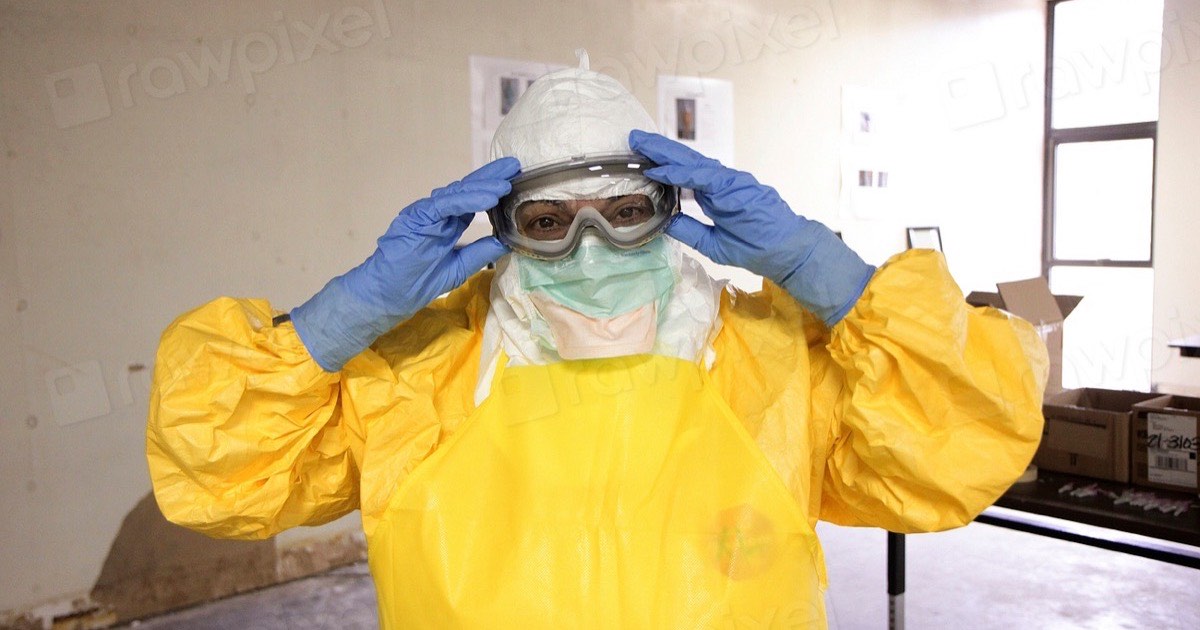 Worker wearing protective safety equipment in an industrial setting