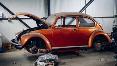 A classic car body panel being prepared for restoration