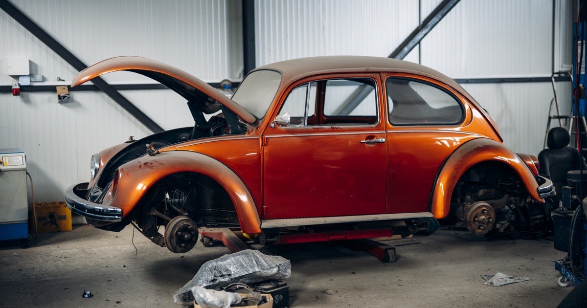 A classic car body panel being prepared for restoration
