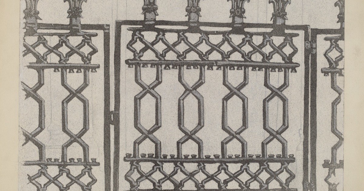 Ornate cast iron railings with surface rust